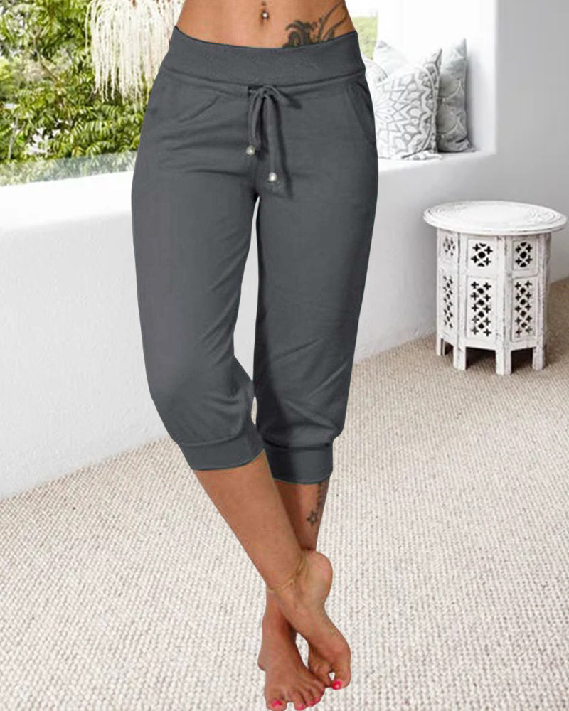 Pantalon à 3/4 longue avec poche de couleur unie