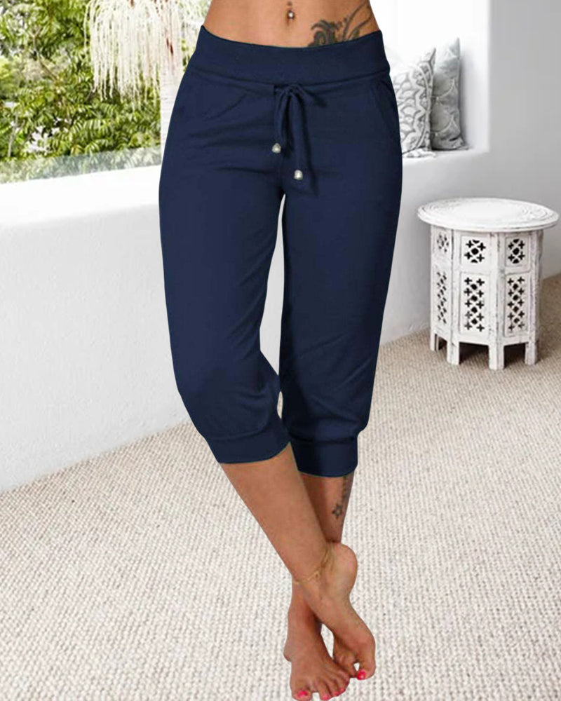 Pantalon à 3/4 longue avec poche de couleur unie