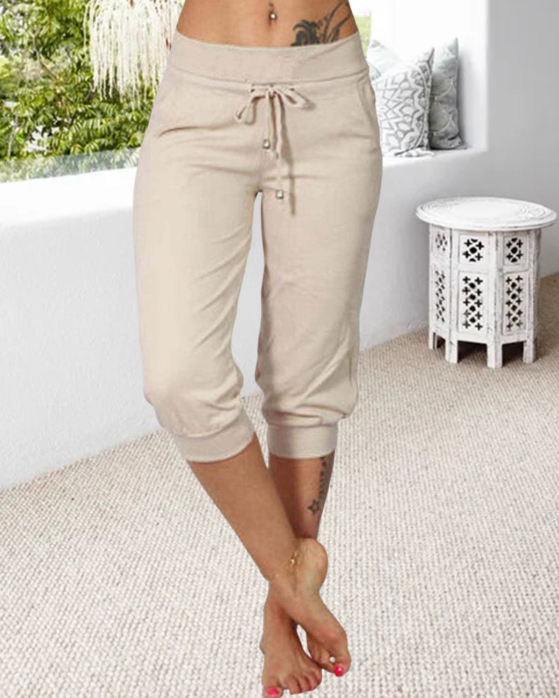 Pantalon à 3/4 longue avec poche de couleur unie