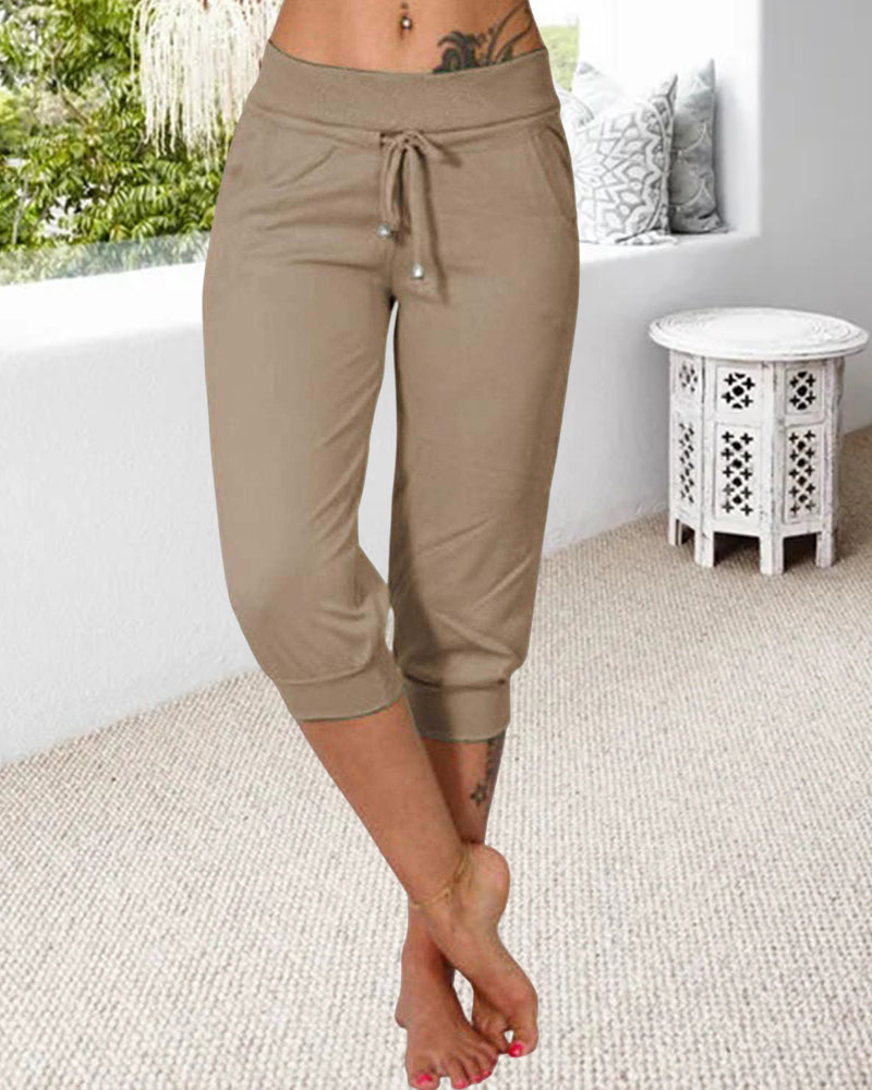 Pantalon à 3/4 longue avec poche de couleur unie