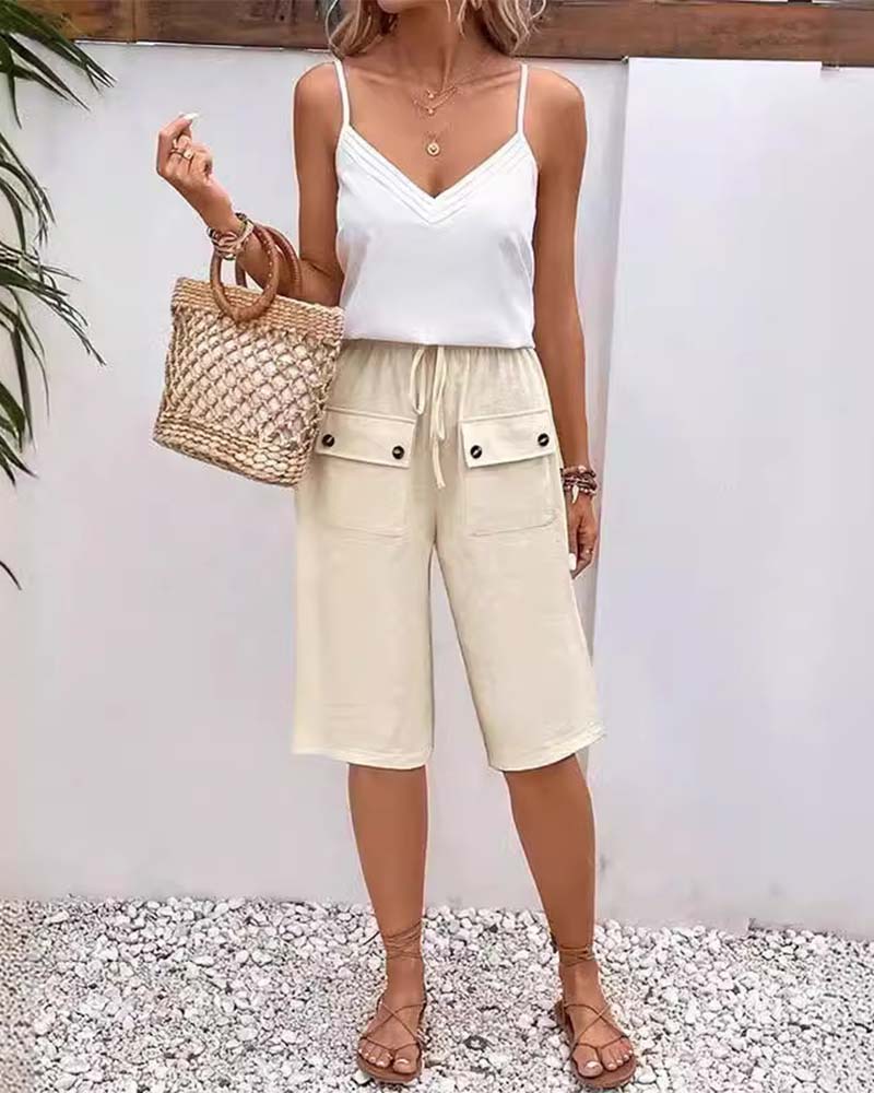 Pantalon mi-long décontracté avec poche de couleur unie